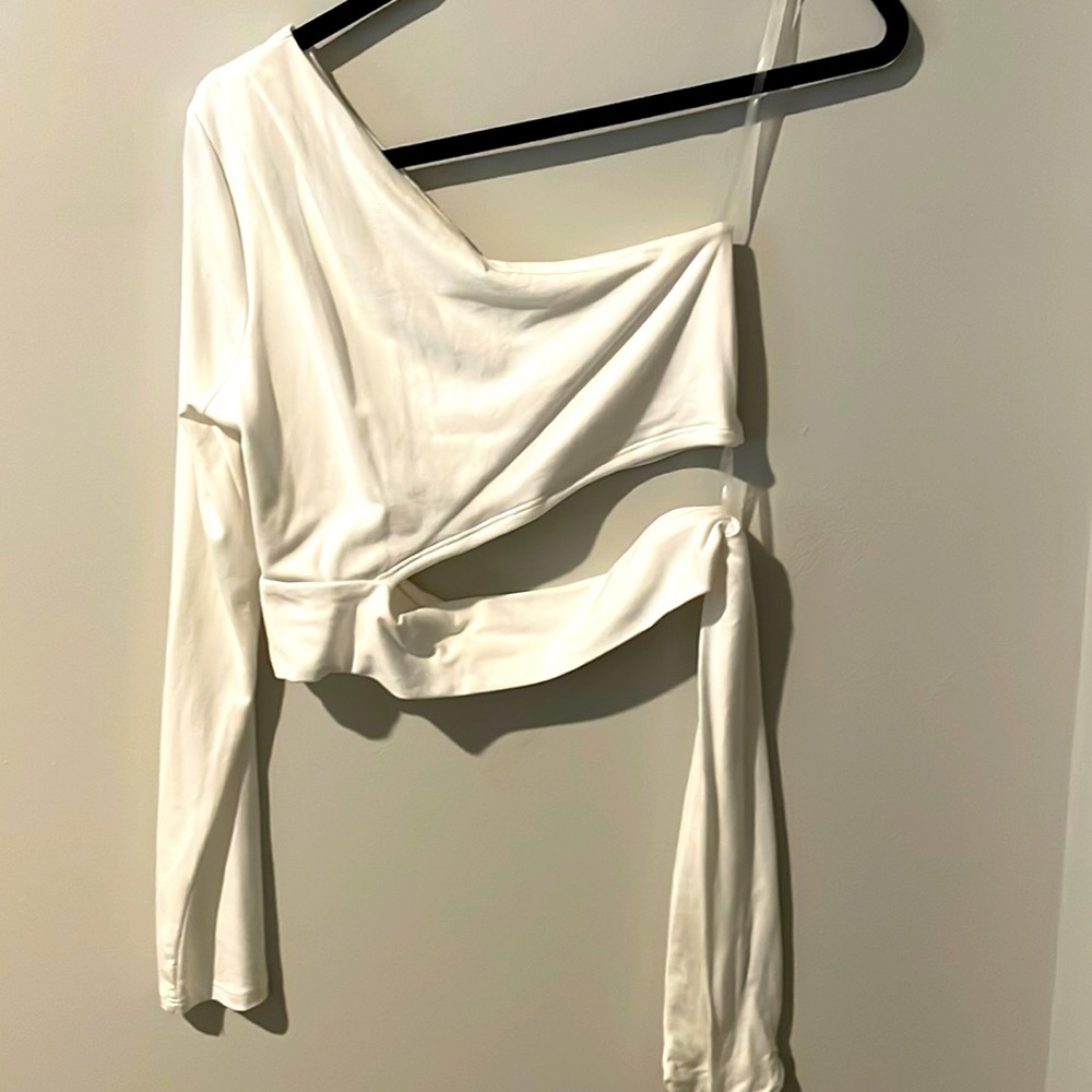 Large fits a medium. White cropped top wraps around waist